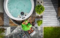 Aerial View of Hot Tub Technician Performing Garden SPA Repair Royalty Free Stock Photo