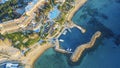 Aerial view of hotel building on sea coastline with blue mediterranean sea water, drone photo of Cyprus resort