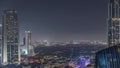 Aerial view of houses in Deira and Dubai creek district with typical old and modern buildings night timelapse. Royalty Free Stock Photo