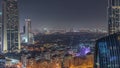 Aerial view of houses in Deira and Dubai creek district with typical old and modern buildings night timelapse. Royalty Free Stock Photo