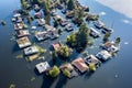Aerial view of houses flooded with dirty water of a river. Buildings and cars submerged in water during an overflow of water
