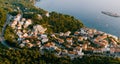 Aerial view of the houses of the seaside town at the foot of the mountains