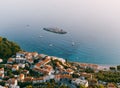 Aerial view of the houses of the seaside town among greenery