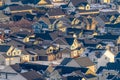 Aerial view of houses on a sunlit and snowy residential community in winter Royalty Free Stock Photo