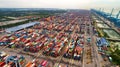 Aerial view of huge industrial port with containers and huge ship. Logistic. Shipping. Cargo. Transport