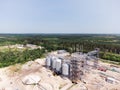 Aerial view of huge modern grain elevator. Food storage, building in progress. Silo farm. Agribusiness development Royalty Free Stock Photo