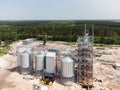 Aerial view of huge modern grain elevator. Food storage, building in progress. Silo farm. Agribusiness development Royalty Free Stock Photo