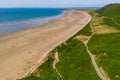 Aerial view of a hugem wide sandy beach at low tide Rhossili, Wales