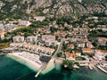 Aerial view of Huma Kotor Bay Hotel and Villas on the seashore at the foot of the mountains. Dobrota, Montenegro