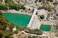 Aerial view at Hydroelectric power station and dum with car on i