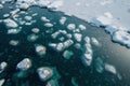 an aerial view of ice floes and water in the arctic ocean, with snow on the ground and ice floes floating on the water