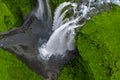 Aerial view of Iceland waterfall over basalt riverbed and mossy cliffs Royalty Free Stock Photo