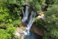 Aerial view of an Idyllic rain forest waterfall, stream flowing in the lush green forest. Royalty Free Stock Photo