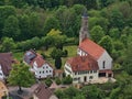 Aerial view of village Honau, Germany located in Echaz valley in Swabian Alb with historic church Galluskirche.