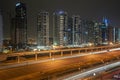 Aerial view of illuminated JLT skyscrapers. Towers along Sheikh Zayed Road.