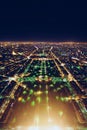 aerial view of illuminated night city panorama of Paris with street lights, drone top view from above, Champs Elysees