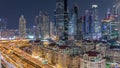 Aerial view of illuminated skyscrapers and road junction in Dubai timelapse Royalty Free Stock Photo