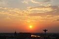 Aerial view image of morning sky in Thailand with silhouette image of Thai style ornament building and beautiful sunrise tropical