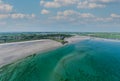 Aerial view of Inchydoney beach near Clonakilty in Ireland with people in the turquoise water Royalty Free Stock Photo