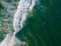 Aerial view of indistinguisable man surfing in Barra da Tijuca beach Royalty Free Stock Photo