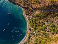 Aerial view of Indonesian town with blue sea water and boats, Bali Royalty Free Stock Photo