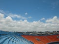 the inside of a baseball stadium, with the sky in the background