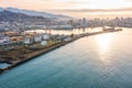 Aerial view industrial cargo and oil port with containers and ship tanker vessel loading in gas and oil terminal station