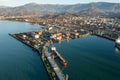 Aerial view industrial cargo and oil port with ship tanker vessel loading in gas and oil terminal station refinery