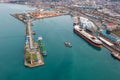 Aerial view industrial cargo and oil port with ship tankers vessel loading in gas and oil terminal station refinery Royalty Free Stock Photo