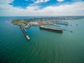 Aerial view of industrial docks and nautical vessel at Yarra river mouth. Williamstown, Melbourne, Australia.