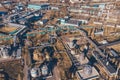 Aerial view of industrial factory or plant buildings with steel storage construction tanks and pipes