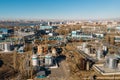 Aerial view of industrial factory or plant buildings with steel storage construction tanks and pipes, oil refinery concept Royalty Free Stock Photo