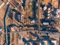 Aerial view of industrial factory or plant buildings with steel storage construction tanks and pipes, oil refinery concept Royalty Free Stock Photo