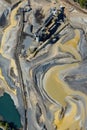 Aerial View of Industrial Mining Operation with Sediment Patterns. Royalty Free Stock Photo