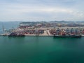 Aerial view of industrial port with containers, Large container vessel unloaded in Port. Royalty Free Stock Photo