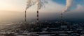 Aerial view of Industrial zone, plants and factories with smoke from chimneys. Air pollution concept. Panorama Royalty Free Stock Photo