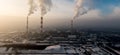 Aerial view of Industrial zone, plants and factories with smoke from chimneys. Air pollution concept. Panorama Royalty Free Stock Photo