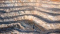 Aerial view of the interior of a deep stone quarry, large rocks