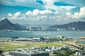 Aerial view of international airport with airplane parking in Hong Kong, China.