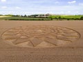 Aerial view of an intricate geometric crop circle formation in a wheat field in Wiltshire, England Royalty Free Stock Photo