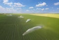 Aerial view of irrigation system rain gun sprinkler on agricultural soybean field Royalty Free Stock Photo