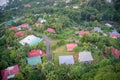 Aerial view of island houses among urban green nature in Mahe, Seychelles