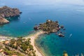 Aerial view of island and Isola Bella beach and blue ocean water