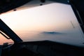 Aerial view of an island surrounded by mist at sunset Royalty Free Stock Photo