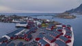 Aerial view of islands with red rorbuer, blue sea, mountain, road