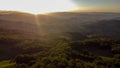 Aerial view of italian countryside at sunset with sun beams Royalty Free Stock Photo