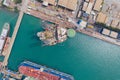 Aerial view of a jack up oil drilling rig and dry dock ship in the shipyard Royalty Free Stock Photo