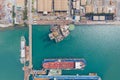 Aerial view of a jack up oil drilling rig and dry dock ship in the shipyard Royalty Free Stock Photo