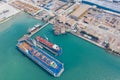 Aerial view of a jack up oil drilling rig and dry dock ship in the shipyard Royalty Free Stock Photo