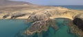 Aerial view of the jagged shores and beaches of Lanzarote, Spain, Canary. Roads and dirt paths. Papagayo beach